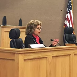 STEPPING DOWN Coast Unified superintendent Victoria Shumacher announces her resignation at a special meeting Oct. 2. - PHOTO BY KAREN GARCIA