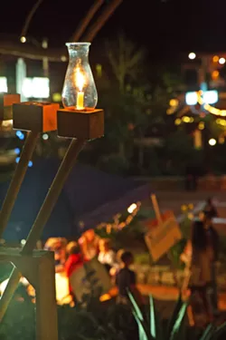 SPECIALLY MADE Old Mission Church Reverend Jim Nisbet and Congregation Beth David Rabbi Harry Manhoff joined forces more than 25 years ago to bring this menorah and a Hanukkah celebration to Mission Plaza. - PHOTOS COURTESY OF THE JCC OF SLO