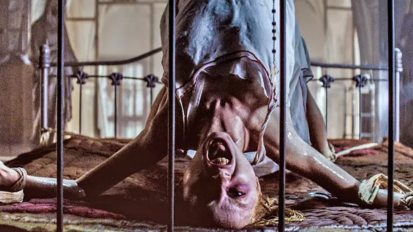 DEVIL'S YOGA? A cadaver (Kirby Johnson) comes alive when a cop, fresh out of rehab, is assigned to guard the city morgue, in The Possession of Hannah Grace. - PHOTO COURTESY OF BROKEN ROAD PRODUCTIONS