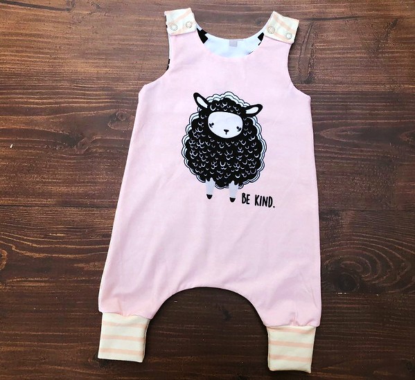 ONESIE Paso Robles resident Angela DiMauro handcrafts clothes, like this onesie, using organic fabric for infants and toddlers. Her pieces are available online under her moniker, Little Quills Clothing. - PHOTO COURTESY OF LITTLE QUILLS CLOTHING