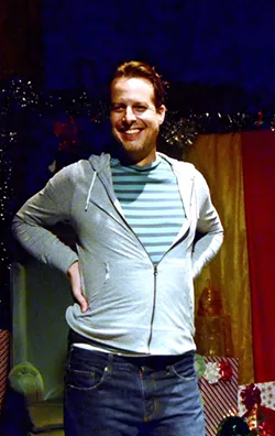 DREAMING OF A WORKING CHRISTMAS Kevin Harris, the managing artistic director for the SLO Repertory Theatre, acts in the one-man show, Santaland Diaries, inspired by a story from author David Sedaris' book, Holidays on Ice. - PHOTOS COURTESY OF THE SLO REPERTORY THEATRE