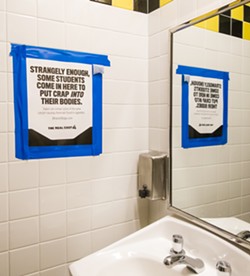 SIGN OF THE TIMES San Luis Obispo High School recently started putting signs like these in the bathrooms as part of an effort to deter students from using electronic cigarettes. - PHOTO BY JAYSON MELLOM