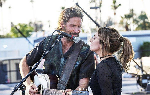 STAR POWER A seasoned performer near the end of his career (Bradley Cooper, left) discovers, nurtures, and falls in love with a talented newcomer (Lady Gaga), in A Star Is Born. - PHOTO COURTESY OF WARNER BROS. PICTURES