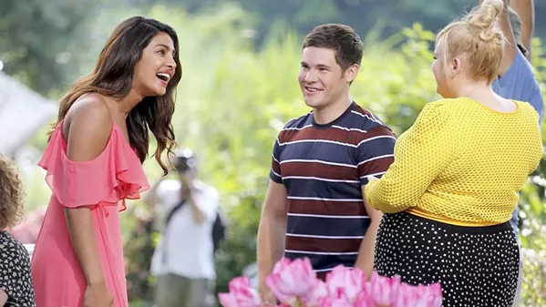 META ROM-COM (Left to right) Isabella (Priyanka Chopra), Josh (Adam Devine), and Natalie (Rebel Wilson) are all living in a romantic comedy, and Natalie loathes romance, in Isn't It Romantic. - PHOTO COURTESY OF BRON STUDIOS