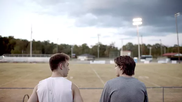 BROTHERS High school runner David (Evan Hofer, left) and his football-playing brother, Zach Truett (Tanner Stine), must persevere through the death of their mother and the abandonment of their father, in the faith-based film, Run the Race, screening exclusively at Downtown Centre. - PHOTO COURTESY OF RESERVE ENTERTAINMENT