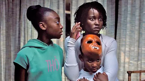 TERRORIZED A family—including mother Adelaide (Lupita Nyong'o right), daughter Zora (Shahadi Wright Joseph, left), and son Jason (Evan Alex, bottom right)—is threatened by evil doppelgängers, in Us. - PHOTO COURTESY OF MONKEYPAW PRODUCTIONS