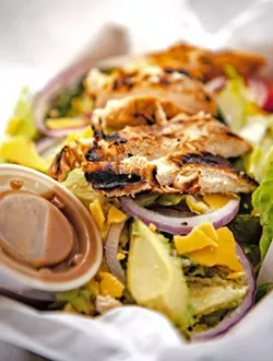 CALI GREENS Citrus marinated grilled chicken, roasted poblano pepper, and applewood bacon marry avocado, tomato, red onion, and aged cheddar—dressed up with cilantro vinaigrette, this is a salad you can sink your teeth into. - PHOTO BY PATRICK IBARRA