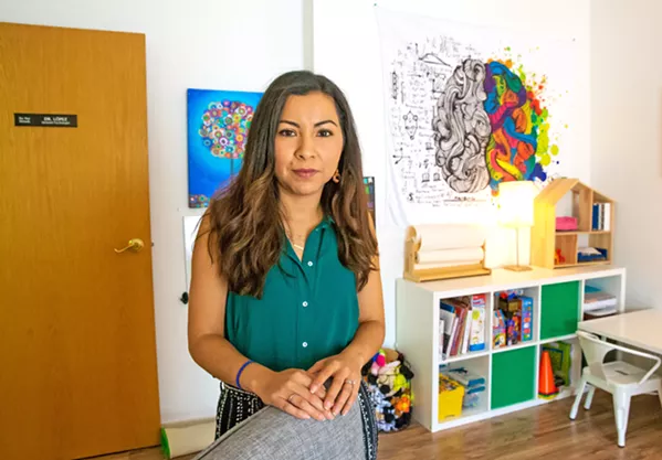 HOLDING UNIVERSALITY Susana Lopez is a clinical psychologist who shares her story of being an undocumented immigrant in the U.S. with the hope of uplifting others who are going through the process of changing their documentation status or pursuing a visa to stay with their families. - PHOTO BY JAYSON MELLOM