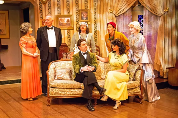 HAUNTED When a night of fun goes awry, the dead and the living must duke it out in Noël Coward's comic play, Blithe Spirit. From left to right: Mrs. Violet Bradman (Rosh Wright), Dr. George Bradman (Gary Paul-Clark), Edith (Kerry DiMaggio), Charles Condomine (Toby Tropper), Ruth Condomine (Rachel Tietz), Madame Arcati (Suzy Newman), and Elvira Condomine (Katie Worley-Beck). - PHOTOS COURTESY OF RYLO MEDIA DESIGN