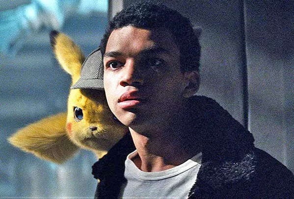 TEAM WORK Detective Pikachu, left, (voiced by Ryan Reynolds) helps Tim Goodman (Justice Smith, right) search for his father, in Pokémon Detective Pikachu. - PHOTOS COURTESY OF LEGENDARY ENTERTAINMENT