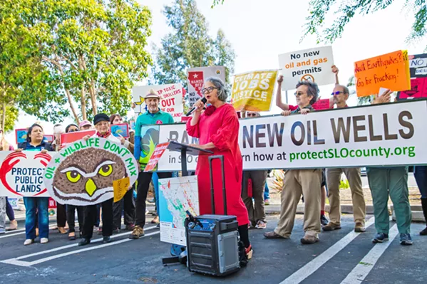RESISTANCE SLO Mayor Heidi Harmon (center) leads a rally on May 22 against a federal plan to increase oil and gas production on public lands in Central California. - PHOTO BY JAYSON MELLOM