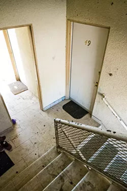 NO HELP Of the many uninhabitable living conditions that tenants have complained about, the dangerous location of the kitchen stove is one of them. According to building codes, stoves should not be surrounded by walls. - PHOTOS BY JAYSON MELLOM