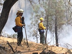 FIRE FIGHTS Firefighters work to put out the 2016 Chimney Fire in northern San Luis Obispo County. Catastrophic fire seasons in 2018 and 2019 triggered a slew of new state laws to address fire prevention, safety, and liability. - FILE PHOTO BY JAYSON MELLOM