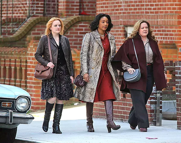 TAKE CHARGE In 1970s New York, three gangsters' wives—(left to right) Claire (Elizabeth Moss), Ruby (Tiffany Haddish), and Kathy (Melissa McCarthy)—decide to continue running their Hell's Kitchen rackets after the men are imprisoned, in The Kitchen. - PHOTO COURTESY OF BRON STUDIOS