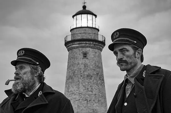 MAD WORLD Two men—Thomas Wake (Willem Dafoe, left) and Ephraim Winslow (Robert Pattinson)—find themselves trapped on a remote island together in the hallucinatory black and white horror fantasy, The Lighthouse, screening exclusively at The Palm Theatre. - PHOTO COURTESY OF A24