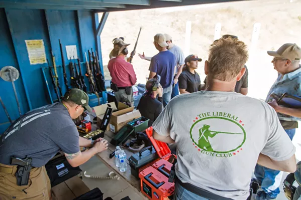 PREPPING FOR CLASS Lever-action rifle class attendees load up their guns with ammunition before the lesson starts on Oct. 26. - PHOTO BY JAYSON MELLOM