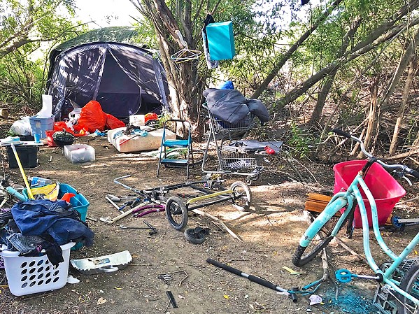 BEFORE Before the Blue Bag pilot launched in September, nearly every corner of the Higuera bridge homeless camp in SLO was overflowing with trash. - PHOTO COURTESY OF TIM WAAG