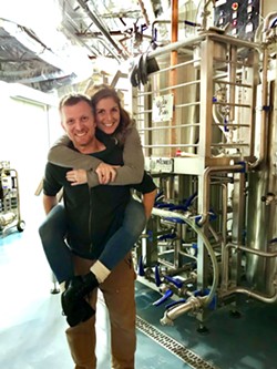 BREWERY PIGGYBACKS Brewmaster Ryan Fields gives his wife, Jacque, a piggyback ride through his brewing facility. The Fieldses have been working insane hours to bring the Atascadero community this gem of a pub, located just over the bridge from Sunken Gardens, across from the Galaxy movie theater. - PHOTOS BY BETH GIUFFRE
