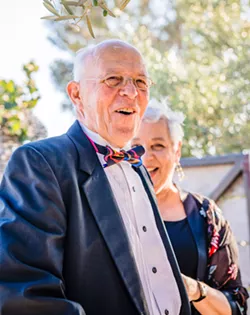 YIN AND YANG Philip and Joanne Ruggles smile at their surprise 50th wedding anniversary party in August 2018. Phil died a little more than a year later, after having an aortic dissection, a highly fatal event that couldn't be properly treated because he was on a blood thinner. - PHOTO COURTESY OF BLAKE ANDREWS