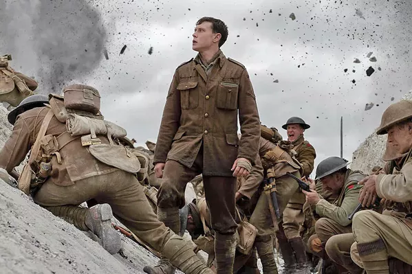 ESSENTIAL MISSION Lance Cpl. Schofield (George MacKay, center) traverses a hellscape in his effort to deliver a message to stop a regiment of his fellow soldiers from charging into a trap. - PHOTOS COURTESY OF DREAMWORKS