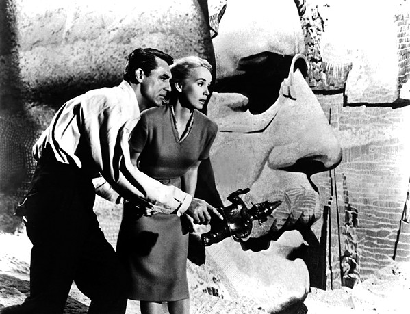 MISTAKEN IDENTITY Roger Thornhill (Cary Grant) and Eve Kendall (Eva Marie Saint) scramble around Mount Rushmore as they evade foreign agents, in Alfred Hitchcock's 1959 classic, North by Northwest, screening at Galaxy on March 1. - PHOTO COURTESY OF METRO-GOLDWYN-MAYER