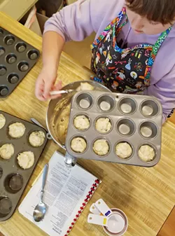 THE MUFFIN GAL I love that my younger daughter is capable of completing every step of our favorite banana muffin recipe. - PHOTOS BY ANDREA ROOKS