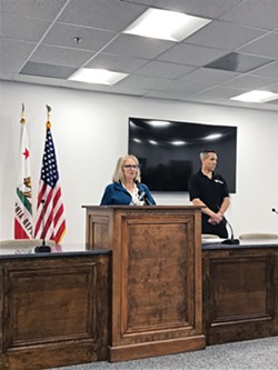 OPTIMISTIC SLO County Public Health Officer Penny Borenstein (at the podium) believes SLO County is ready to implement a phased plan to reopen the community. - FILE PHOTO BY PETER JOHNSON