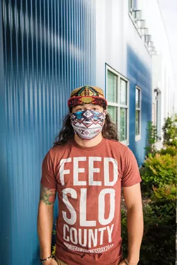 ESSENTIAL Shadoe Venezuela, 27, is a warehouse worker and driver for the SLO County Food Bank, which has seen the demand for its inventory skyrocket during COVID-19. - PHOTO BY JAYSON MELLOM