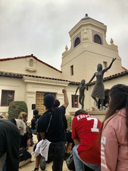 MOMENT OF SILENCE Protestors kneel for eight minutes and 46 seconds of silence in memory of George Floyd outside Santa Maria City Hall. - PHOTO BY MALEA MARTIN