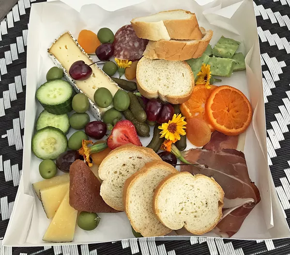 COLORFUL CHEESE BOX LouLou Cheese Girl, Maliysa Lou made sure I came home with a box of cheese and charcuterie. It lasted five minutes on my kitchen counter. My boys even ate the flowers. I almost lost a finger trying to secure my share of the prosciutto. - PHOTOS BY BETH GIUFFRE