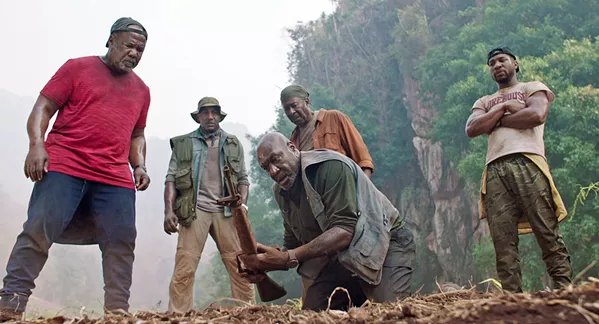 BLOOD IS THICKER Four Vietnam Vets—(left to right) Melvin (Isiah Whitlock Jr.), Eddie (Norm Lewis), Paul (Delroy Lindo), Otis (Clarke Peters)—and Paul's son, David (Jonathan Majors), go to Vietnam to repatriate the remains of the soldiers' squad leader and find buried CIA gold they hid, in Spike Lee's excellent Da 5 Bloods, screening on Netflix. - PHOTO COURTESY OF 40 ACRES & A MULE FILMWORKS
