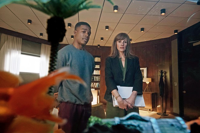 REMEMBER? Counselor Heidi Bergman (Julia Roberts, right) treats soldiers with PTSD like Walter Cruz (Stephan James) with an experimental memory-erasing drug, in Homecoming, available on Amazon Prime.