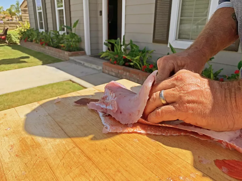 FILET-O-FISH There are several tricks to filleting fresh caught fish, but the most common involves slicing along the spine and above the ribs from collar to tail. - PHOTO BY CAMILLIA LANHAM