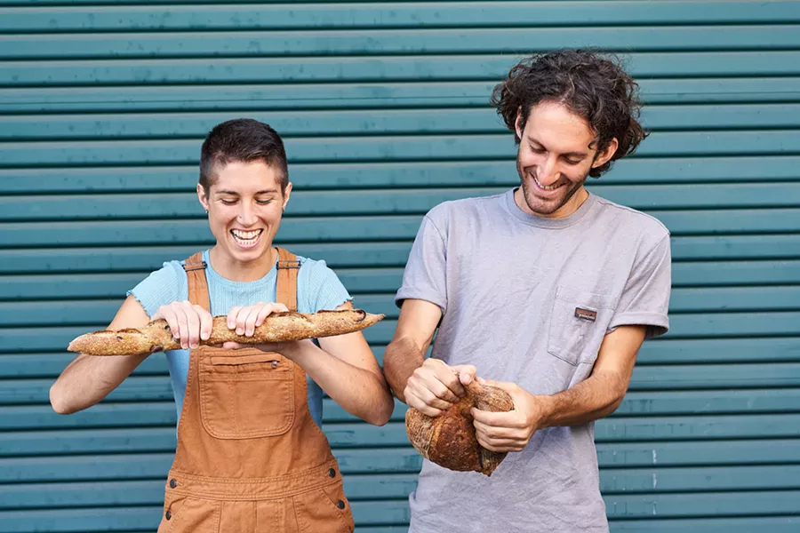 BREAD MAGIC Mariah Grady, co-owner of Bread Bike (seen here after she shaved her head), is all about creating magic. The SLO native never tires of baking (and sampling) every loaf that comes out of the oven. - PHOTOS COURTESY OF PRESTON RICHARDSON