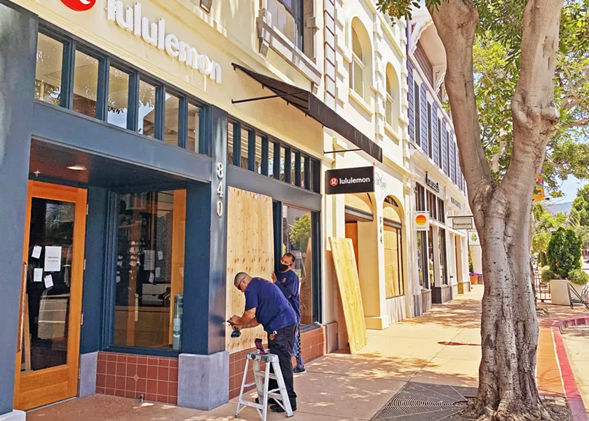 BOTH SIDES Discussions between business owners and protesters following downtown stores boarding up in anticipation of protests back in June has continued to overshadow conversations about racial injustice. - FILE PHOTO BY CAMILLIA LANHAM
