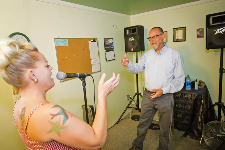 MADDEX VOCAL TECHNIQUE Voice teacher JP Maddex (right) works with MarciJean Fambrini of the Belmont Kings at Morro Bay's Central Coast Music, where Maddex has quietly worked for the last 14 years improving local singers' technique. - PHOTO BY JAYSON MELLOM
