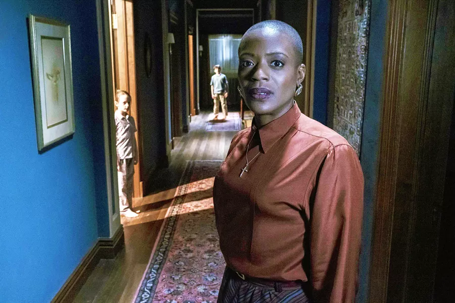 BUMP IN THE NIGHT Housekeeper Mrs. Grose (T'Nia Miller, foreground) and the Wingrave orphans—Flora (Amelie Bea Smith) and Miles (Benjamin Evan Ainsworth)—share their house with strange apparitions, in the Netflix miniseries The Haunting of Bly Manor. - PHOTO COURTESY OF AMBLIN TELEVISION