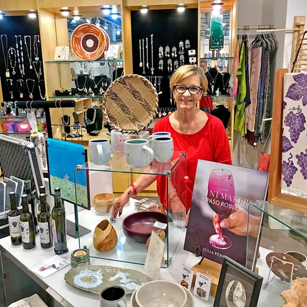STUDIOS ON THE PARK Sales Manager Elaina Stangle of the Up Front Gift Store stands among the wares of artists participating in Handcrafted for the Holidays, which runs through Dec. 30, in Paso Robles' Studios on the Park. - PHOTO COURTESY OF ELAINA STANGLE