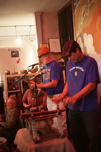 ‘WE’RE ASKING FOR RAIN’: Tim Stein (center) invokes a simple plea for rain as a bevy of percussionists keep rhythmic time. - PHOTO BY GLEN STARKEY
