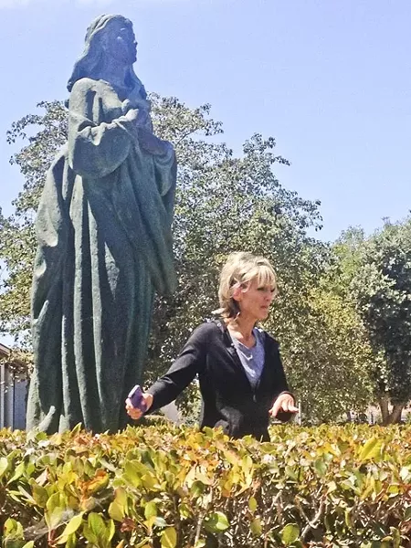 THERE'S SOMETHING ABOUT MARY: Wendelin Van Draanen drew heavily on real Santa Maria sites and landmarks to create the fictional city of Santa Martina. She gave a documentary crew a tour of some of the main stops, including St. Mary of the Assumption Church, where the author climbed into the bushes to demonstrate how two of her main characters hid in an attempt to catch a criminal in Sammy Keyes and the Hotel Thief. - PHOTO BY RYAN MILLER