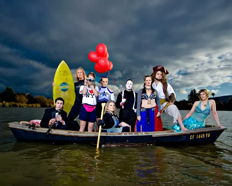 ALL IN THE SAME BOAT : (l-r) Daniel Salas (musician), Shelley Malcolm (surfer), Sarah Worrell (tourist), Courtney Rucker (cheerleader), Christy Heron (‘50s housewife) Amy Asman (mime), Adaire Hahn (belly dancer), Ryan Miller (pirate), and Heather Weltner (mermaid). Art director: Ashley Schwellenbach. Hair and makeup by Shelby Hood. Boat (the Mudhen) courtesy of Glen Starkey. - PHOTO BY STEVE E. MILLER