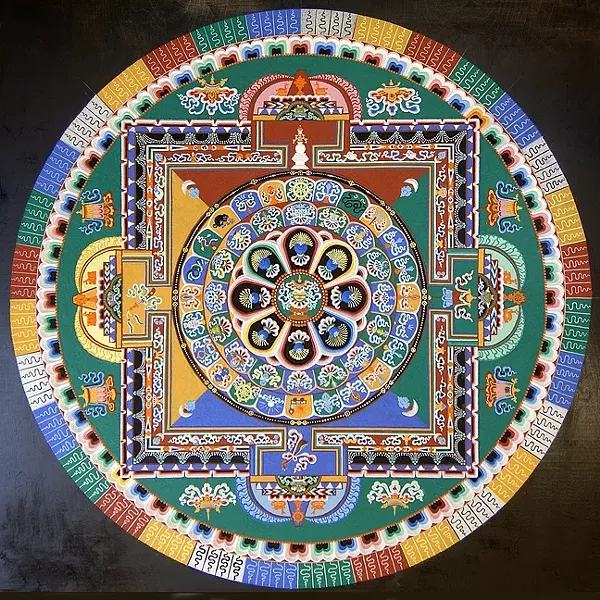 COLOR WHEEL: For each mandala, the monks pour millions of grains of sand into a traditional pattern using a funnel tool called chak-pur. The process can take up to five days to complete. - PHOTO COURTESY OF ANET CARLIN