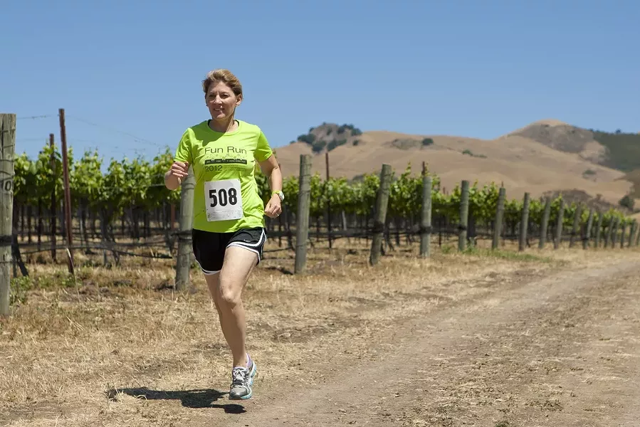 RUN FIRST, WINE AFTER : Marian Fiorentino, organizer of the 20th annual Marianne Talley Fun Run, is hoping for a record 500 participants this year. - PHOTO BY STEVE E. MILLER