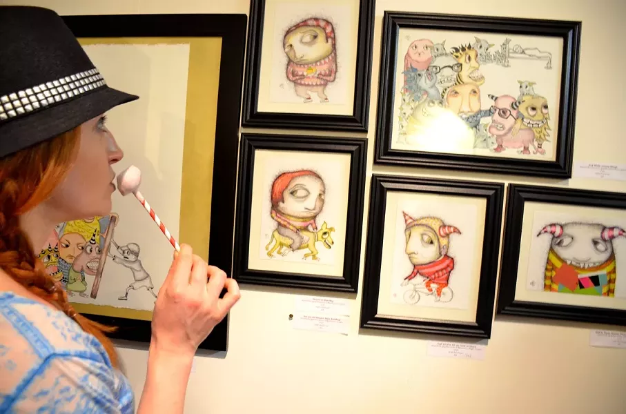 BROWNIE POINTS: Cat looks into the eyes of artist Bret Brown’s madcap creations. - PHOTO BY JESSICA PEÑA