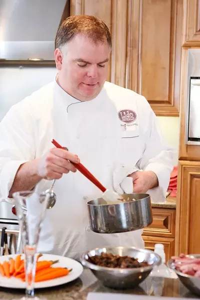 SAUCE FOR YOU: Chef Evan Treadwell prepares a tasty sauce for the night's offering. - PHOTO BY STEVE E. MILLER