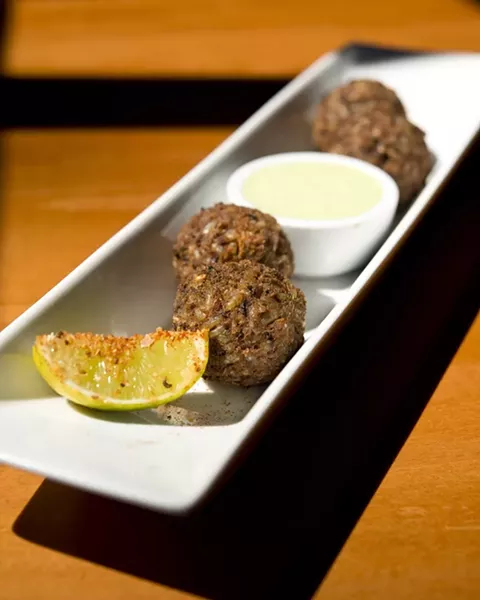 GLUTEN FREE: Black bean and avocado fritters with lime crema (can be vegan if the crema is excluded) from Luna Red. - PHOTO BY STEVE E. MILLER