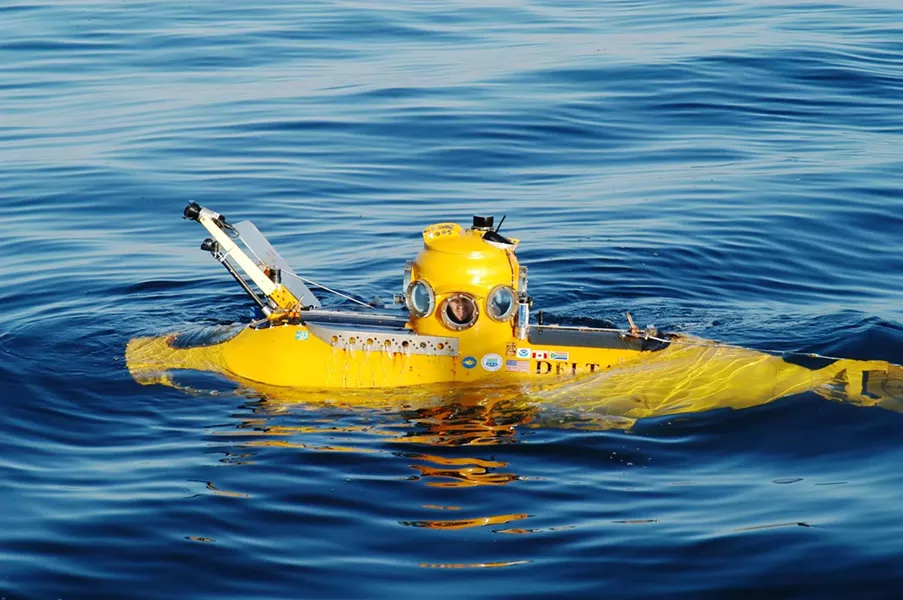 THIRD TIME DOWN : Task-force guide Robert Schwemmer, peering from an observation port of the Delta submersible on a dive to the wreck years ago, will soon learn whether the Montebello has since significantly deteriorated. - PHOTO BY TASK FORCE