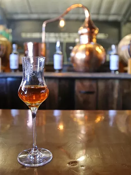 NOT YOUR MOM’S JUICE : Paso Robles area grapes have graduated to the next level of liquor at places like Wine Shine, which distills brandy from the fruit that makes the area famous. - PHOTO BY DYLAN HONEA-BAUMANN