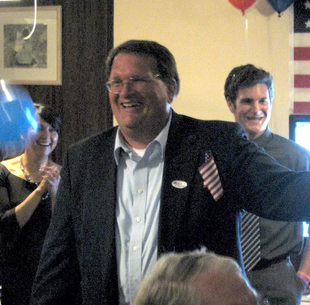 TWIDDLING THUMBS : Despite holding the lead in the race for District 4 supervisor, Mike Zimmerman and his guests spent most of the night waiting for the election results to update. - PHOTO BY COLIN RIGLEY