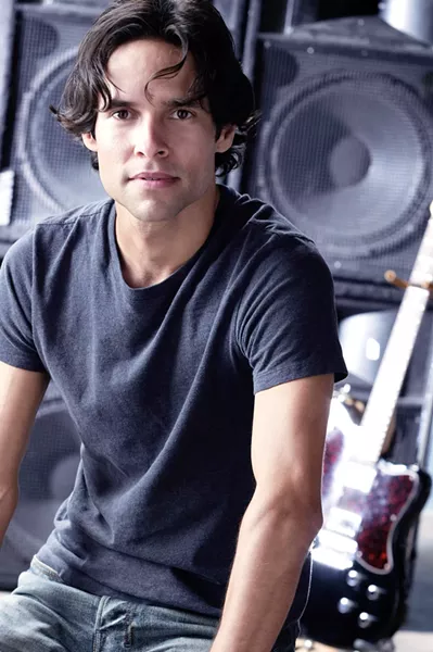 MY, WHAT A NICE YOUNG MAN : Damon Castillo gives it away for free on June 21 on the Promenade at Avila Beach. - PHOTO COURTESY OF DAMON CASTILLO